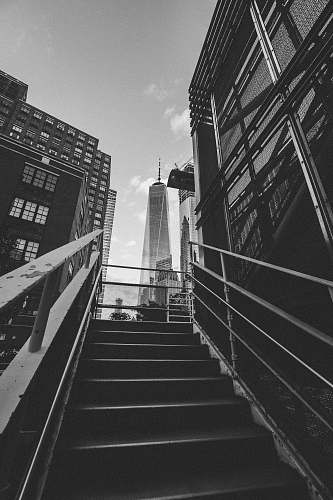grey grayscale photography of stairway leading to building architecture