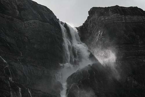 nature grayscale photography of waterfalls outdoors