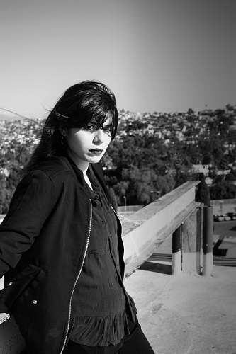 apparel grayscale photography of woman in jacket clothing