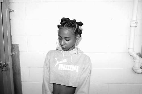 person grayscale photography of woman wearing crop top sweatshirt human