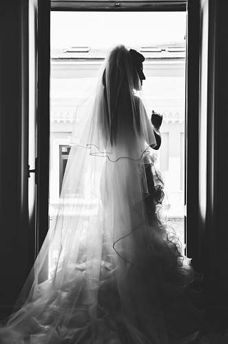 clothing grayscale photography of woman wearing wedding dress apparel