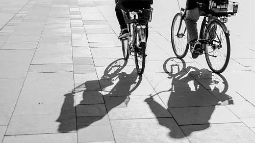 bicycle grayscape photo of person riding bike bike