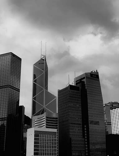 building grey clouds over city buildings office building