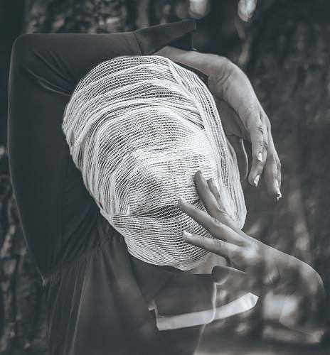 grey greyscale photography of people wearing black long-sleeved shirt finger