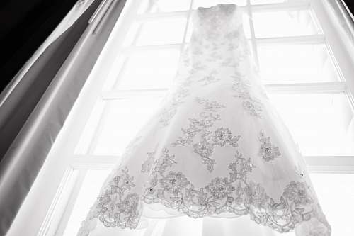 clothing hanged white and gray wedding dress apparel