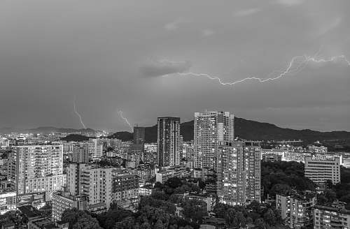 nature lightning strikes over the city weather