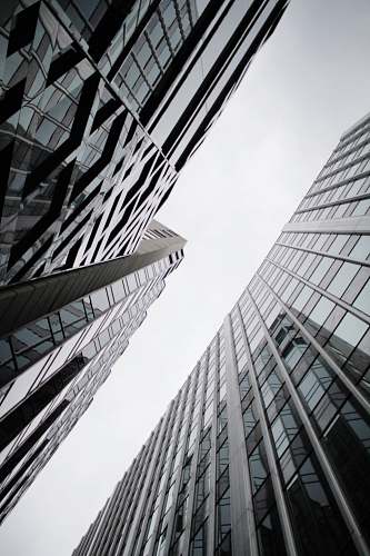 architecture low angle photography of curtain wall glass buildings building