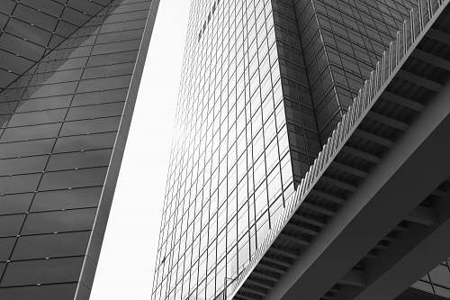 building low angle photography of glass curtain building office building