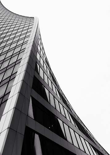 architecture low angle photography of grey high-rise building building