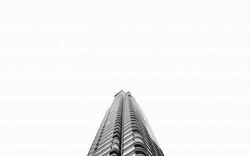 building low-angle photography of grey high-rise building architecture
