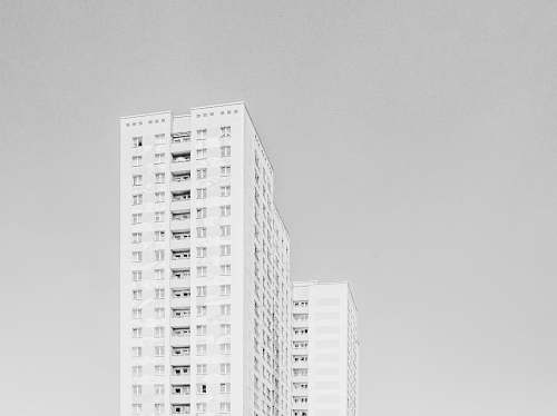 building low angle photography of highrise building housing