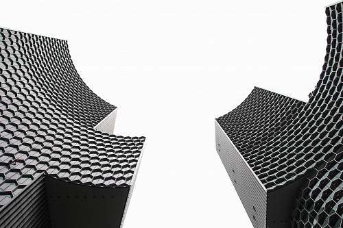 chair low angle photography of two high-rise buildings furniture