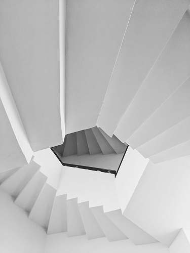 banister low angle view of white spiral stairs handrail