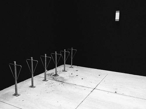 toronto low light photography of metal poles chair