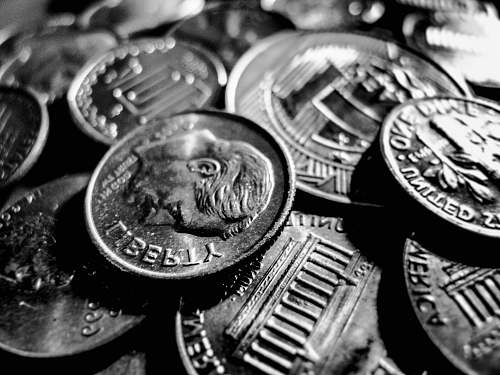 coin macro photo of round silver-colored coins money
