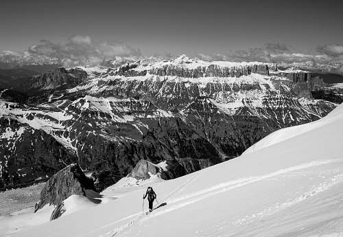 nature man on top of snow capped mountain mountain