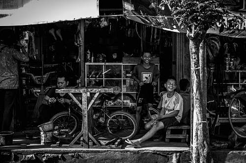 human man sitting beside bike person
