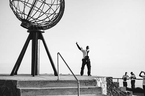 human man standing near metal structure person