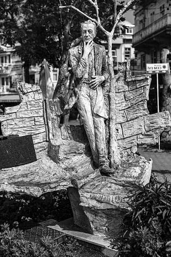 grey man statue sculpture