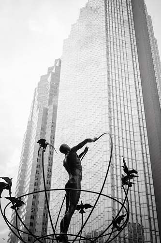 building man statue near building city