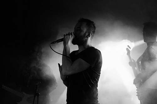 human man using corded microphone person