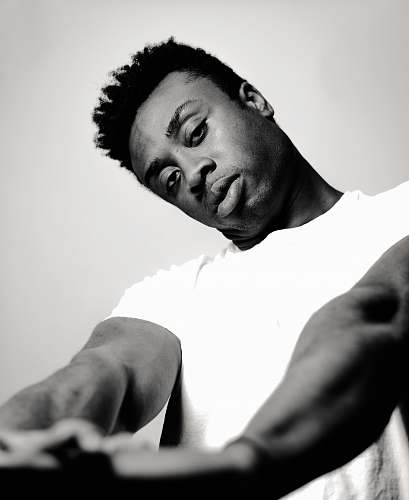 human man wearing crew-neck t-shirt grayscale photo person