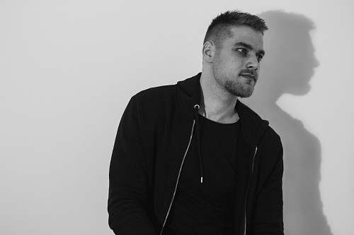 person men's black crew-neck shirt and black zip-up hoodie human