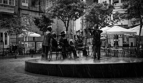 path people sitting on bench statue restaurant