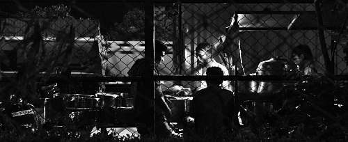 human people talking behind fence person