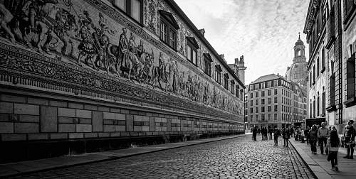 path people walking by concrete wall walkway