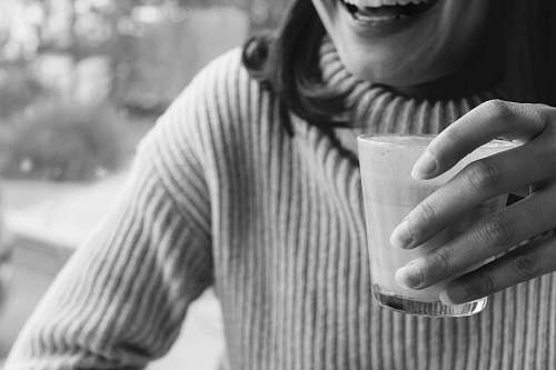 human person holding cup smiling person