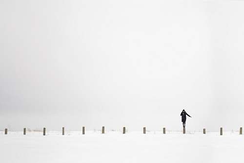 snow person standing on post canada