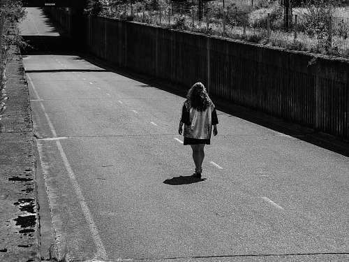 apparel person walking on pathway clothing