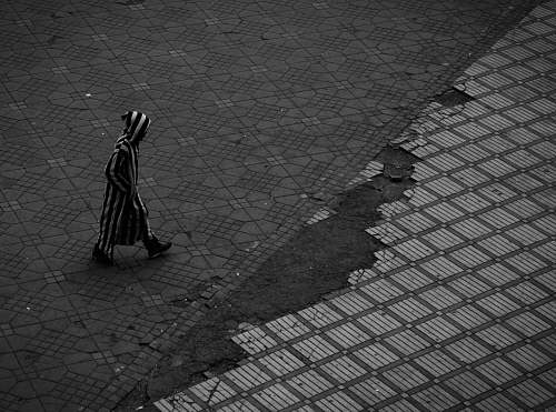 stripes person walking on road marrakesh