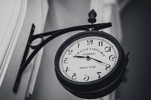 grey round black wall clock wristwatch