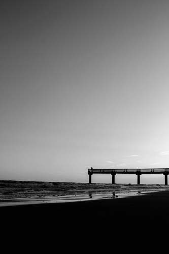 water silhouette of bridge pier