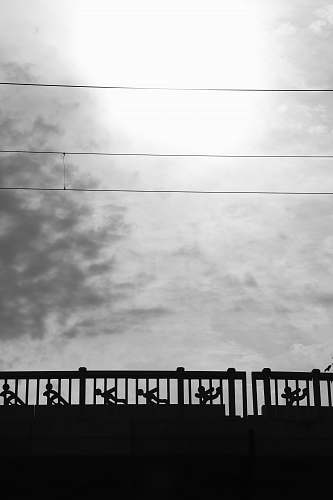 water silhouette of fence at daytime waterfront