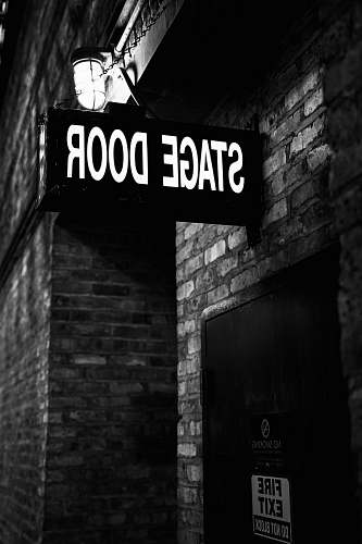 brick Stage Door signage building
