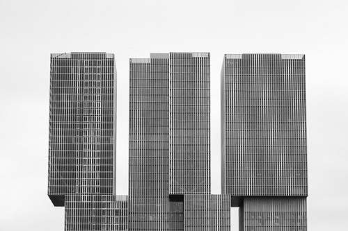 building three gray concrete high rise buildings architecture