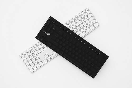 keyboard two black and white wireless keyboards hardware
