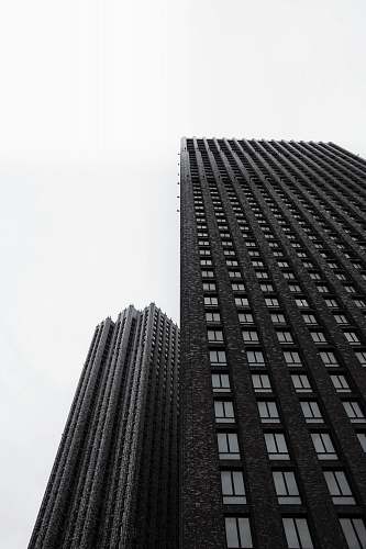 building two black high-rise buildings city