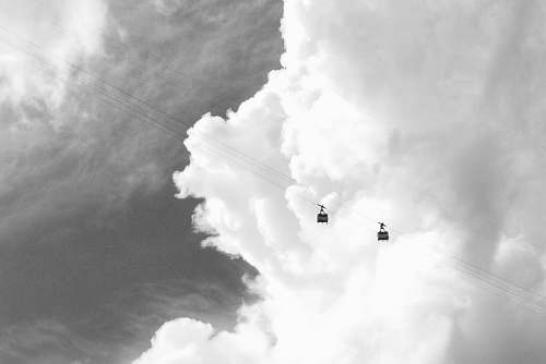 adventure two cable cars under white clouds leisure activities