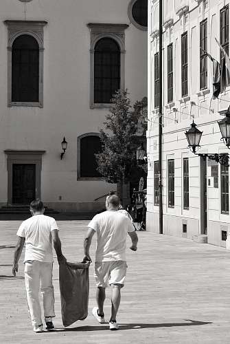human two men carrying sack person