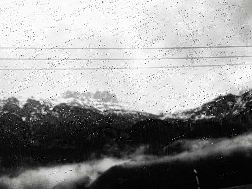 white view of mountains during a rainy weather rain