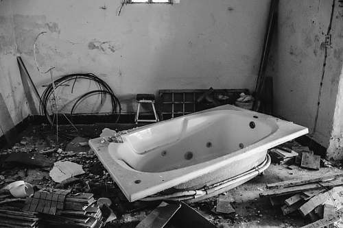 tub white bathtub inside room with scattered woods jacuzzi