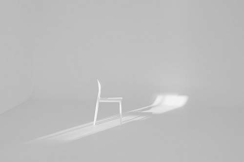 chair white chair on white surface furniture