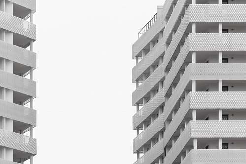 building white concrete buildings under white sky urban