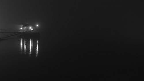 grey white house and body of water novi sad