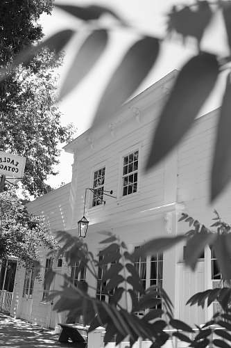 building white house with electric sconce countryside