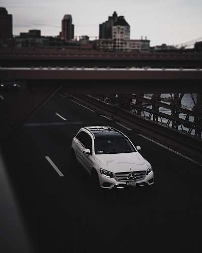 car white Mercedes-Benz SUV on road automobile
